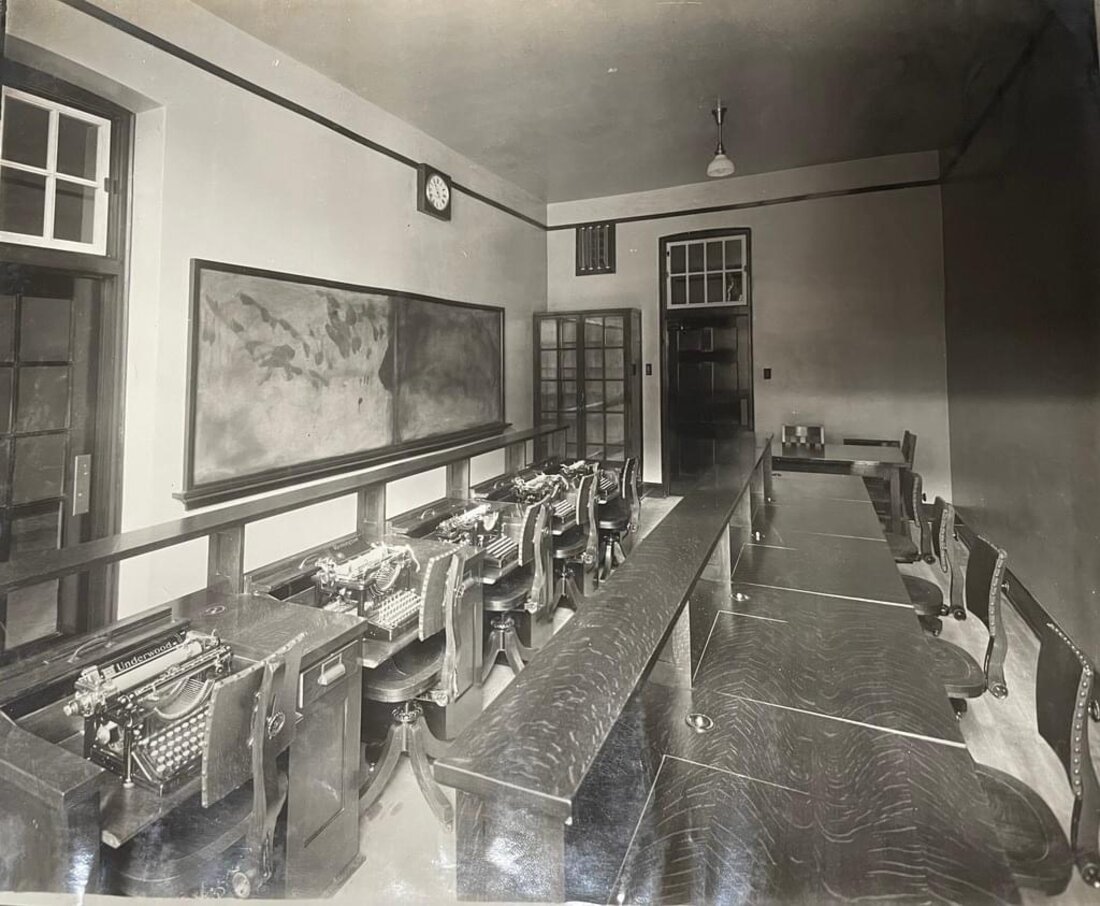 Historic business classroom with rows of Underwood typewriters